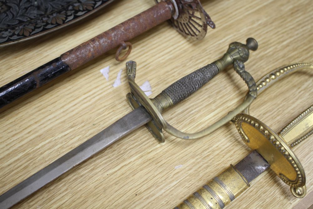 A cut steel dress sword by Ede & Ravenscroft of London and two brass hilted dress swords